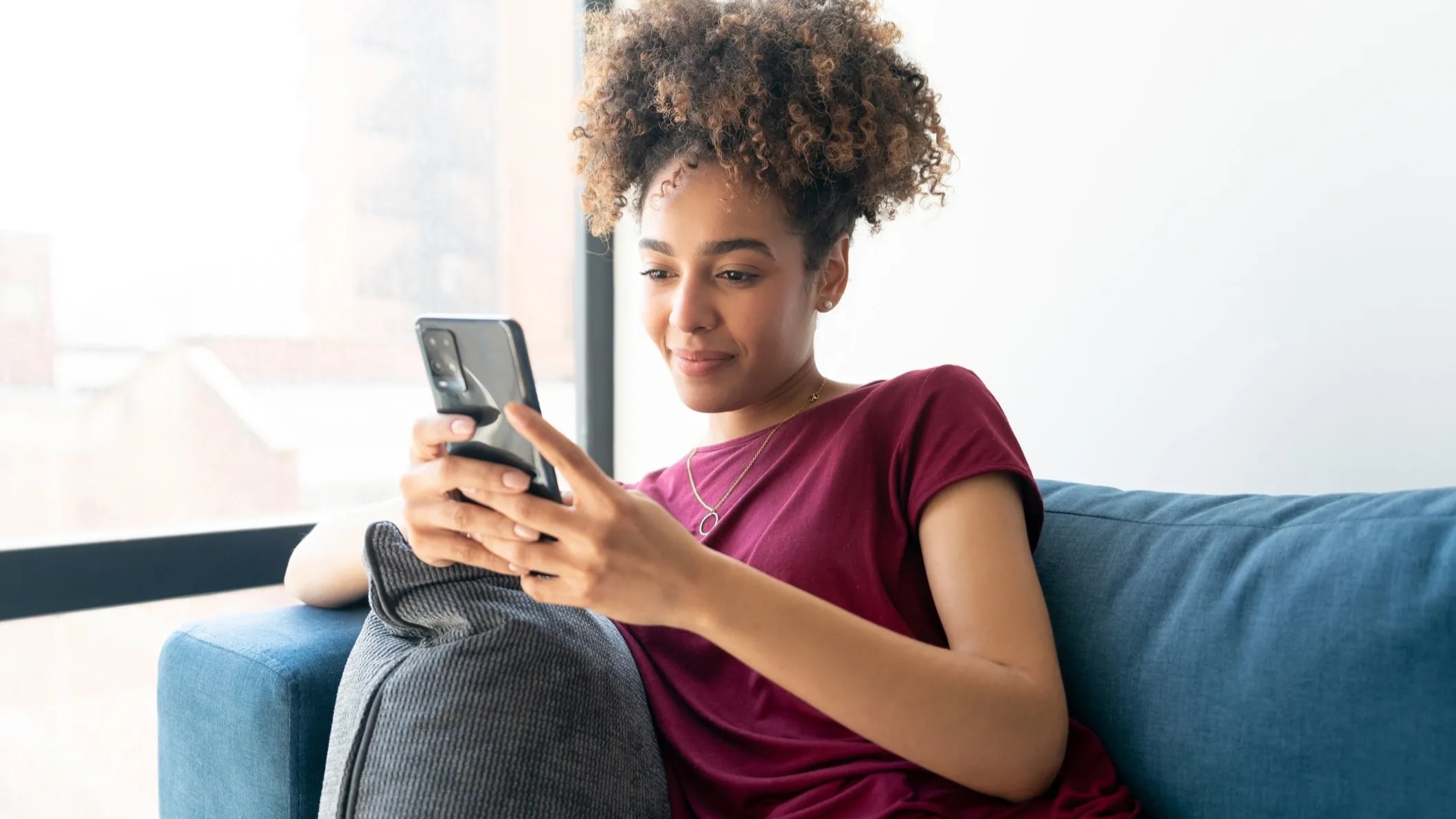 Person reaching out for support via text message